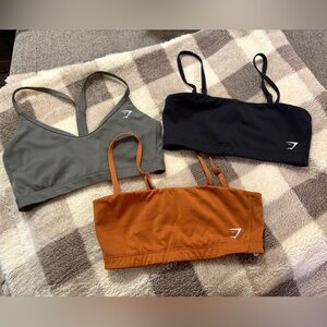 Set of Three Gymshark Sports Bras in Black, Green, and Orange